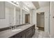Modern bathroom featuring double sinks, gray cabinets, and a shower with white subway tile at 1100 Howell Mill Nw Rd # 408, Atlanta, GA 30318