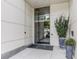 Front entrance of building with glass doors and landscaping at 1100 Howell Mill Nw Rd # 408, Atlanta, GA 30318