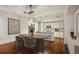 Dining room with a modern light fixture with a view of the kitchen and island at 1100 Howell Mill Nw Rd # 408, Atlanta, GA 30318