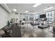 Well-equipped gym with treadmills, bikes, weights, and large windows overlooking a pool at 1100 Howell Mill Nw Rd # 408, Atlanta, GA 30318