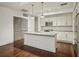 Modern kitchen with stainless steel appliances, white cabinets, and a central island at 1100 Howell Mill Nw Rd # 408, Atlanta, GA 30318