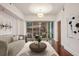 Bright living room with hardwood floors, modern lighting, and a balcony with views at 1100 Howell Mill Nw Rd # 408, Atlanta, GA 30318