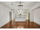 Open living space with modern kitchen, stainless appliances, and hardwood floors at 1100 Howell Mill Nw Rd # 408, Atlanta, GA 30318