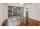 Cozy living room with hardwood floors and a large window overlooking the city at 1100 Howell Mill Nw Rd # 408, Atlanta, GA 30318