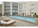 Outdoor pool with lounge chairs on the sundeck of the building at 1100 Howell Mill Nw Rd # 408, Atlanta, GA 30318