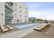 Rooftop pool with lounge chairs and exterior view at 1100 Howell Mill Nw Rd # 408, Atlanta, GA 30318