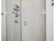 Modern shower featuring chrome fixtures, a caddy, and white subway tile at 1100 Howell Mill Nw Rd # 408, Atlanta, GA 30318