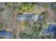 Overhead view of the home showcasing the roof, driveway, and surrounding tree coverage at 120 Maryeanna Ne Dr, Atlanta, GA 30342