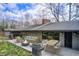 Backyard deck, perfect for outdoor dining and relaxing, with a fire pit and grill at 120 Maryeanna Ne Dr, Atlanta, GA 30342