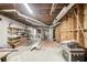 Spacious unfinished basement featuring exposed utilities, shelving and concrete flooring at 120 Maryeanna Ne Dr, Atlanta, GA 30342