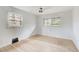 Bedroom featuring hardwood floors, two windows, and neutral color scheme at 120 Maryeanna Ne Dr, Atlanta, GA 30342
