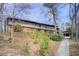 Charming multi-level home with brick facade, mature trees, and a long driveway at 120 Maryeanna Ne Dr, Atlanta, GA 30342