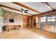 Spacious kitchen with brick accent wall, retro cabinets, and an expansive tile floor at 120 Maryeanna Ne Dr, Atlanta, GA 30342
