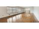 Bright and open living room featuring gleaming hardwood floors and expansive windows with natural light at 120 Maryeanna Ne Dr, Atlanta, GA 30342