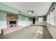 Cozy living room with a brick fireplace, wainscoting, and neutral carpet at 120 Maryeanna Ne Dr, Atlanta, GA 30342