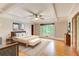 Spacious main bedroom boasting a coffered ceiling, large windows, hardwood flooring, and a decorative rug at 120 Maryeanna Ne Dr, Atlanta, GA 30342