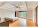 Bright main bedroom featuring a coffered ceiling, large windows, and hardwood flooring at 120 Maryeanna Ne Dr, Atlanta, GA 30342