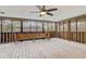 A screened patio offers an inviting outdoor space with wooden bench seating and views of backyard at 120 Maryeanna Ne Dr, Atlanta, GA 30342
