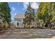 Large backyard with a patio and mature trees, offering ample space for outdoor activities at 1239 Bonshaw Trl, Marietta, GA 30064