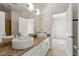 Dual sinks and granite countertops in a well-lit bathroom for convenience and style at 1239 Bonshaw Trl, Marietta, GA 30064