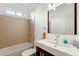 Bathroom featuring tub with tile surround, and sink with large mirror at 1239 Bonshaw Trl, Marietta, GA 30064