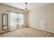 Bedroom with carpet, decorative light fixture, window and side mirror at 1239 Bonshaw Trl, Marietta, GA 30064