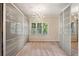 Spacious walk-in closet with carpet, built-in shelving, and a decorative light fixture at 1239 Bonshaw Trl, Marietta, GA 30064
