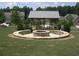 Community firepit area featuring stone seating and a gazebo, creating a cozy gathering spot for residents at 1239 Bonshaw Trl, Marietta, GA 30064