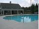 Inviting community pool with a covered seating area and ample lounge chairs for residents to enjoy at 1239 Bonshaw Trl, Marietta, GA 30064