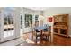 Sunny dining area features an exterior door, multiple windows and wooden flooring at 1239 Bonshaw Trl, Marietta, GA 30064