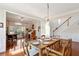 Bright dining room with wood floors and an adjacent sitting room and staircase at 1239 Bonshaw Trl, Marietta, GA 30064
