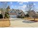 Beautiful two-story brick home featuring a spacious driveway and a two-car garage at 1239 Bonshaw Trl, Marietta, GA 30064