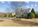 A beautiful brick home with a well-manicured lawn and mature trees at 1239 Bonshaw Trl, Marietta, GA 30064