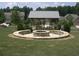 Community outdoor firepit with built-in stone benches, perfect for gathering on cool evenings at 1239 Bonshaw Trl, Marietta, GA 30064