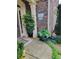 Charming front entrance with potted plants, brick accents, and a welcoming atmosphere at 1239 Bonshaw Trl, Marietta, GA 30064