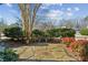 Landscaped front yard with stone pathway and bench seating at 1239 Bonshaw Trl, Marietta, GA 30064