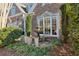 Charming outdoor area featuring a stone fountain, manicured hedges, and classic brick accents at 1239 Bonshaw Trl, Marietta, GA 30064