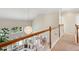 Well-lit upstairs hallway offering views of the living room and outdoor greenery through large windows at 1239 Bonshaw Trl, Marietta, GA 30064