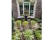 Elegant landscaping featuring a fountain, chairs, and lush greenery at 1239 Bonshaw Trl, Marietta, GA 30064