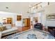 Large living room with hardwood floors, a fireplace and a view to a modern kitchen at 1239 Bonshaw Trl, Marietta, GA 30064