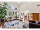 Bright, expansive living room featuring a soaring ceiling, large windows, and hardwood flooring at 1239 Bonshaw Trl, Marietta, GA 30064