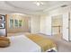 Spacious main bedroom featuring a tray ceiling, access to an upper floor, and en suite bathroom at 1239 Bonshaw Trl, Marietta, GA 30064