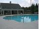 Enjoy the community pool with chairs and tables ready for entertaining at 1239 Bonshaw Trl, Marietta, GA 30064