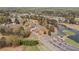 Aerial view of the golf course and lake with residential homes and clubhouse at 179 Country Club Dr, Hiram, GA 30141