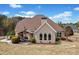 Backyard features a covered patio area with ample seating, ideal for outdoor relaxation and entertaining at 179 Country Club Dr, Hiram, GA 30141
