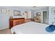 A well-decorated bedroom with light blue walls, a wooden bed frame, and tasteful decor, offering a serene retreat at 179 Country Club Dr, Hiram, GA 30141