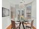 Bright breakfast nook with chandelier and windows at 179 Country Club Dr, Hiram, GA 30141