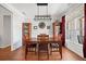 Cozy dining room with modern lighting and hardwood floors at 179 Country Club Dr, Hiram, GA 30141