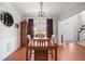 Well-lit dining room with wood table and ample natural light at 179 Country Club Dr, Hiram, GA 30141