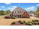 Charming two-story home with manicured lawn and brick and siding exterior at 179 Country Club Dr, Hiram, GA 30141